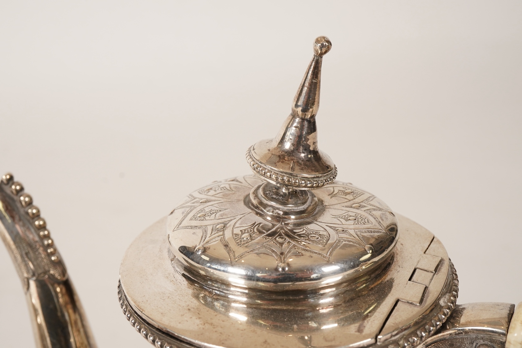 A Victorian ornate silver four piece tea and coffee service, by Thomas Smily